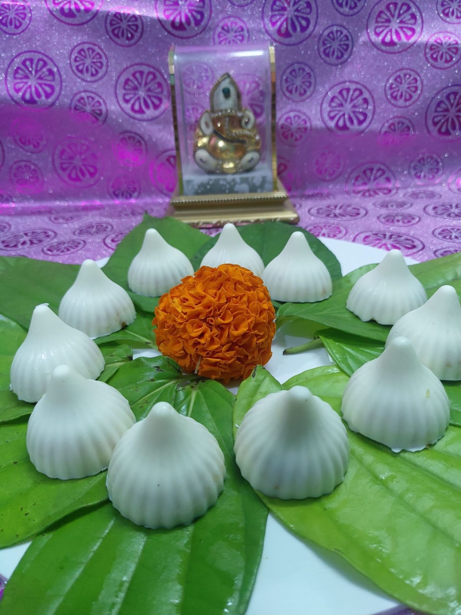 White modaks styled on paan leaves