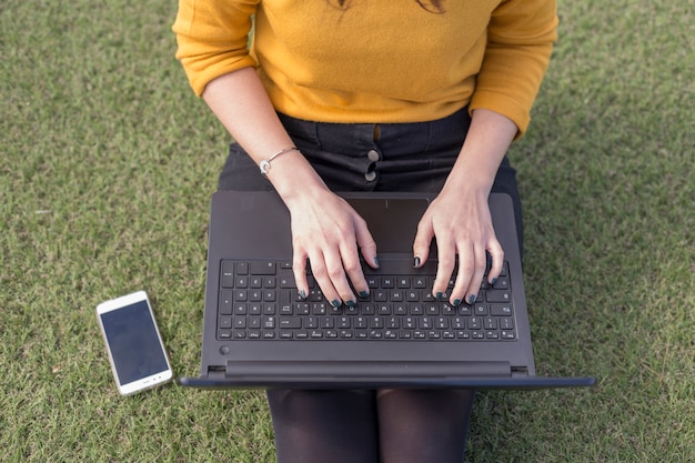 blogger writing on laptop