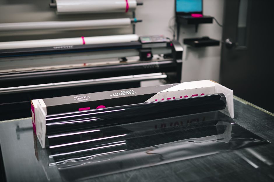 vinyl cutting machine cutting sticker roll in print shop