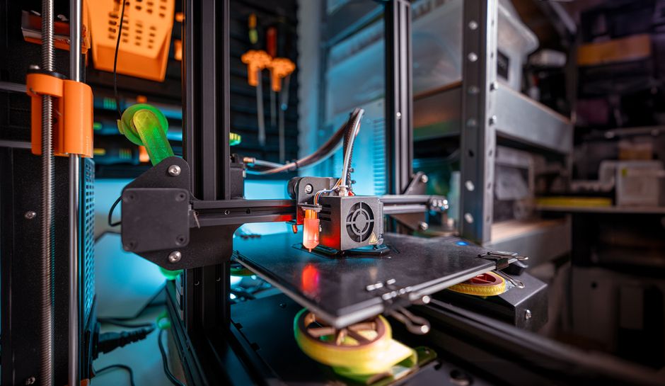 3D printer producing prototype in creative workshop
