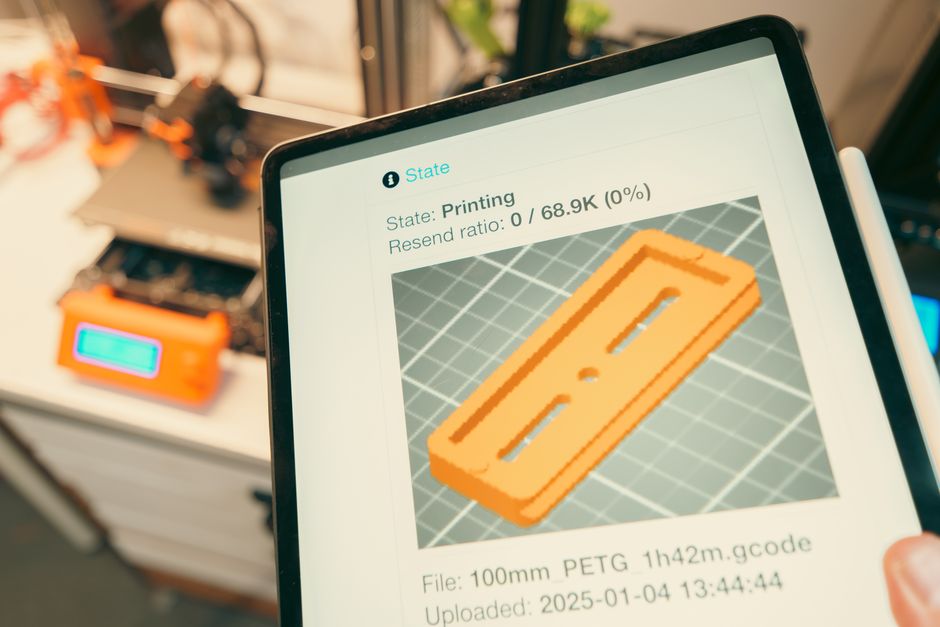 3D printed plastic parts and digital design screen