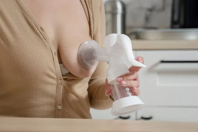 Woman using breast feeding pump 1